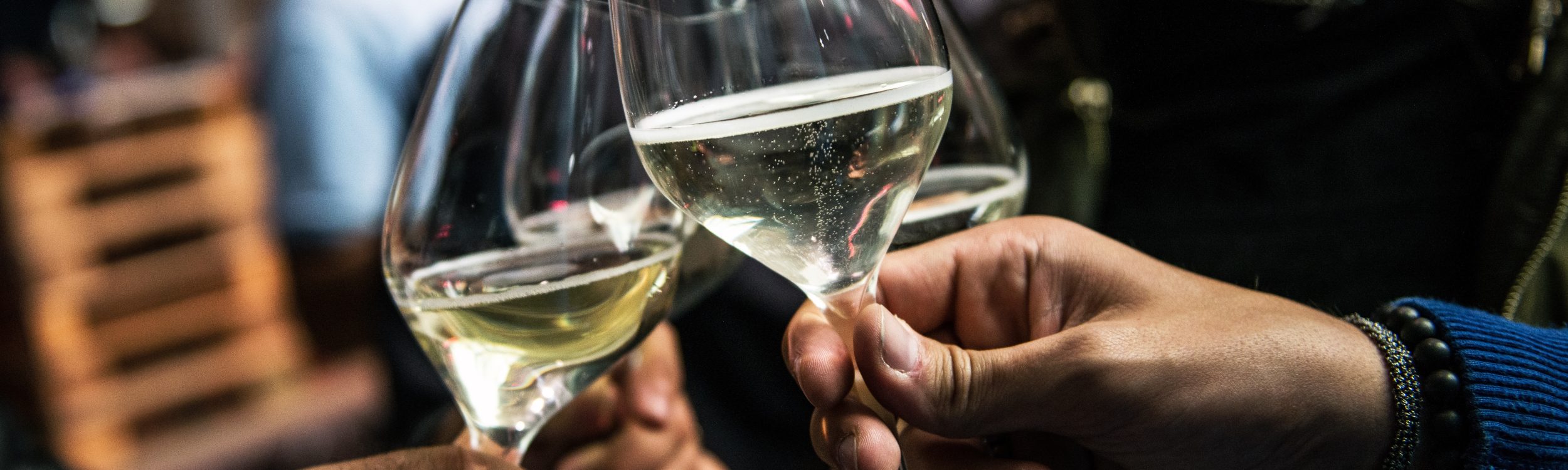 Glasses making a toast - perhaps to successful radio partnerships